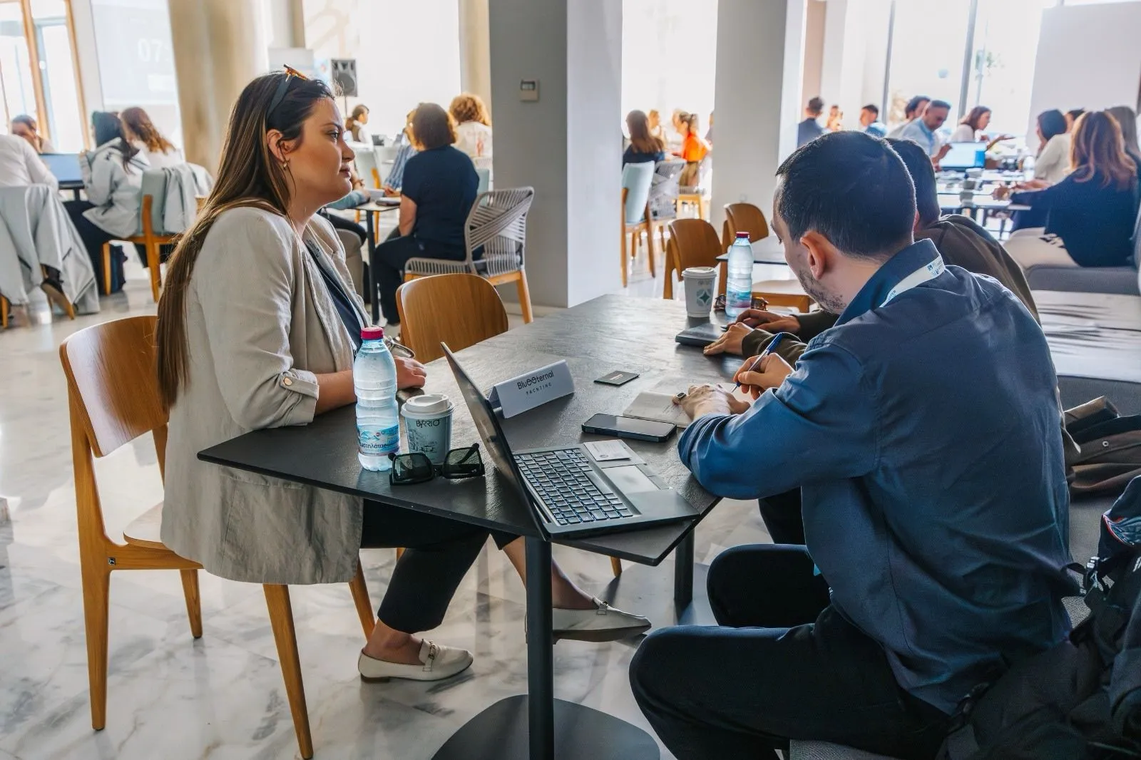 Yacht4Less girl participating at an international B2B even during a meeting with partners